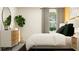Well-lit bedroom featuring a comfortable bed and modern furniture at 9404 Runaway Breeze Dr, Land O Lakes, FL 34637