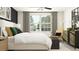 Bright bedroom with large window and plenty of natural light at 9404 Runaway Breeze Dr, Land O Lakes, FL 34637
