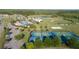 Aerial view showing tennis courts, basketball court, and pool at 9404 Runaway Breeze Dr, Land O Lakes, FL 34637