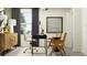 Home office with desk, chair, and light wood cabinet at 9404 Runaway Breeze Dr, Land O Lakes, FL 34637