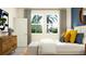 Bright bedroom with a queen-size bed and large windows at 9706 Minnow Ray Dr, Land O Lakes, FL 34638