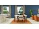 Dining area with wood table and orange rug at 9706 Minnow Ray Dr, Land O Lakes, FL 34638