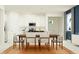 Kitchen and dining area with wood table and white chairs at 9706 Minnow Ray Dr, Land O Lakes, FL 34638
