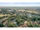 Aerial view of condo community with pool and lush landscaping at 113 Woodlake Wynde # 19, Oldsmar, FL 34677