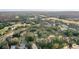 Aerial view showing community, pool, and surrounding landscape at 113 Woodlake Wynde # 19, Oldsmar, FL 34677