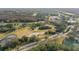 Aerial view showcasing golf course and surrounding landscape at 113 Woodlake Wynde # 19, Oldsmar, FL 34677