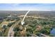 Aerial view of condo community near golf course and lake at 113 Woodlake Wynde # 19, Oldsmar, FL 34677