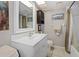 Clean bathroom with a white vanity, shower/tub combo, and updated fixtures at 113 Woodlake Wynde # 19, Oldsmar, FL 34677