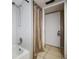 Bathroom with shower/tub combo and tiled flooring at 113 Woodlake Wynde # 19, Oldsmar, FL 34677