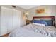 Cozy bedroom with a plush bed, built-in shelving, and soothing decor at 113 Woodlake Wynde # 19, Oldsmar, FL 34677
