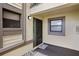 Condo entry with private door and small patio area at 113 Woodlake Wynde # 19, Oldsmar, FL 34677