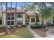 Well-maintained condo building with landscaped grounds at 113 Woodlake Wynde # 19, Oldsmar, FL 34677