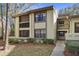 Well-maintained condo building with landscaped grounds at 113 Woodlake Wynde # 19, Oldsmar, FL 34677