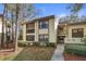 Exterior view of condo building with landscaped grounds at 113 Woodlake Wynde # 19, Oldsmar, FL 34677