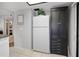 Kitchen with white appliances and pantry at 113 Woodlake Wynde # 19, Oldsmar, FL 34677