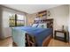 Main bedroom with plush bed, large window, and wood flooring at 113 Woodlake Wynde # 19, Oldsmar, FL 34677