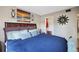 Main bedroom with king bed and access to a walk-in closet at 113 Woodlake Wynde # 19, Oldsmar, FL 34677