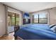 Spacious main bedroom with access to screened porch and ample natural light at 113 Woodlake Wynde # 19, Oldsmar, FL 34677