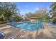 Inviting community pool with plenty of lounge chairs at 113 Woodlake Wynde # 19, Oldsmar, FL 34677
