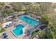 Aerial view of community pool and lap pool with spacious deck at 113 Woodlake Wynde # 19, Oldsmar, FL 34677