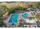 Resort-style pool and lap pool with surrounding amenities at 113 Woodlake Wynde # 19, Oldsmar, FL 34677
