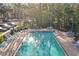 Relaxing community pool area with plenty of seating at 113 Woodlake Wynde # 19, Oldsmar, FL 34677