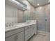 Double vanity bathroom with a large walk-in shower at 11482 Boundless Ter, Venice, FL 34293