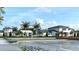 Community clubhouse with parking and landscaping at 11482 Boundless Ter, Venice, FL 34293