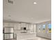 Spacious kitchen with island, stainless steel appliances, and white cabinetry at 11482 Boundless Ter, Venice, FL 34293