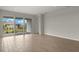 Open concept living room with tile floors and access to the backyard at 11482 Boundless Ter, Venice, FL 34293