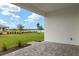Covered patio overlooking a lake and green space at 11482 Boundless Ter, Venice, FL 34293