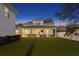 Large backyard featuring a covered patio ideal for outdoor dining and entertainment at 120 25Th N Ave, St Petersburg, FL 33704