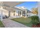 Picturesque backyard includes brick pavers, a putting green, and a covered patio, ideal for recreation at 120 25Th N Ave, St Petersburg, FL 33704