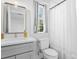 Bright bathroom featuring modern fixtures, a sleek vanity, and a shower with a curtain at 120 25Th N Ave, St Petersburg, FL 33704