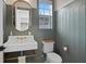 Stylish powder room with wainscoting, brass fixtures, and a unique wash basin at 120 25Th N Ave, St Petersburg, FL 33704