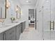 Elegant bathroom features marble floors, a glass shower, and gray cabinets at 120 25Th N Ave, St Petersburg, FL 33704