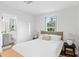 Cozy bedroom with a comfortable bed and bright natural light from the window at 120 25Th N Ave, St Petersburg, FL 33704