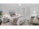 Bedroom showcasing a ceiling fan, neutral tones, a sitting area and bedside tables at 120 25Th N Ave, St Petersburg, FL 33704