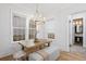 Bright dining room with natural light, featuring a wood table with pendant lighting at 120 25Th N Ave, St Petersburg, FL 33704