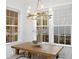 Bright dining room featuring a wood table with pendant lighting and large windows at 120 25Th N Ave, St Petersburg, FL 33704