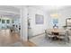 Elegant dining room featuring a modern chandelier, wainscoting, and hardwood floors at 120 25Th N Ave, St Petersburg, FL 33704