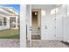 Exterior entranceway features brick pavers, an open door to a staircase, and a view of the backyard at 120 25Th N Ave, St Petersburg, FL 33704