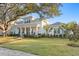 Charming two-story home with inviting front porch, swing, and lush landscaped yard at 120 25Th N Ave, St Petersburg, FL 33704