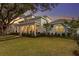 Inviting two-story home boasting a welcoming front porch, swing, and landscaped front yard at 120 25Th N Ave, St Petersburg, FL 33704
