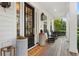 Inviting front porch with rocking chairs, porch swing, and attractive landscaping at 120 25Th N Ave, St Petersburg, FL 33704