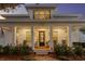 Charming front porch with classic columns, rocking chairs, and a welcoming entrance at 120 25Th N Ave, St Petersburg, FL 33704