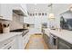 Gourmet kitchen featuring stainless steel appliances, custom cabinets, and large island with seating at 120 25Th N Ave, St Petersburg, FL 33704