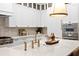 Luxury kitchen featuring an island with bar seating, high-end appliances, and custom cabinetry at 120 25Th N Ave, St Petersburg, FL 33704