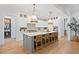 Kitchen island with seating, pendant lights, and a seamless transition into the breakfast room at 120 25Th N Ave, St Petersburg, FL 33704