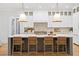Kitchen island with seating, modern pendant lights, and a view into the prep space at 120 25Th N Ave, St Petersburg, FL 33704